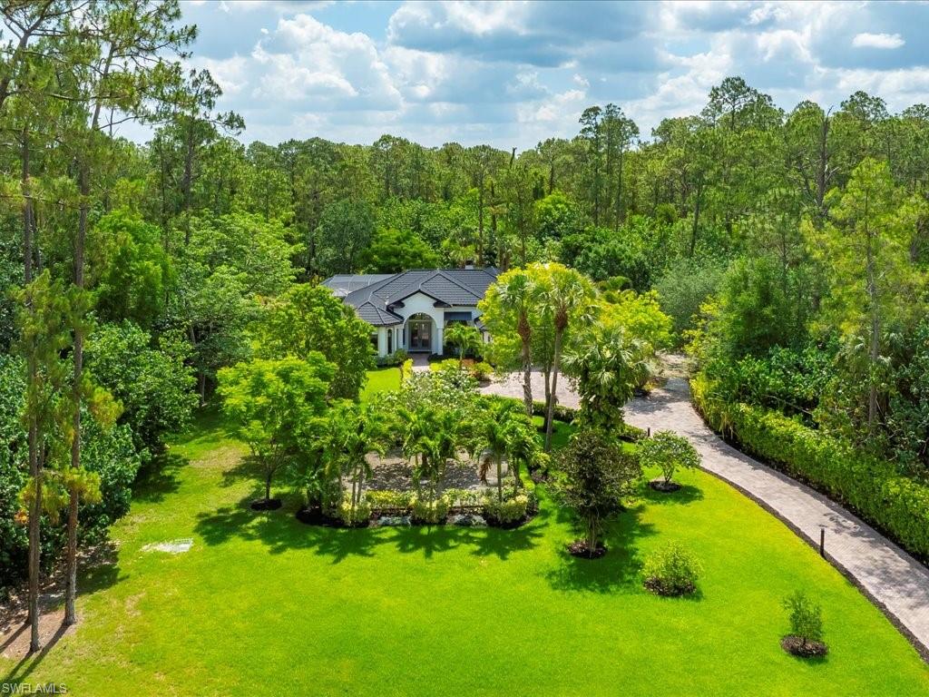 2360 19th Street Southwest Naples, FL 34117 - Photo 3 of 50 View of subject property featuring a forest