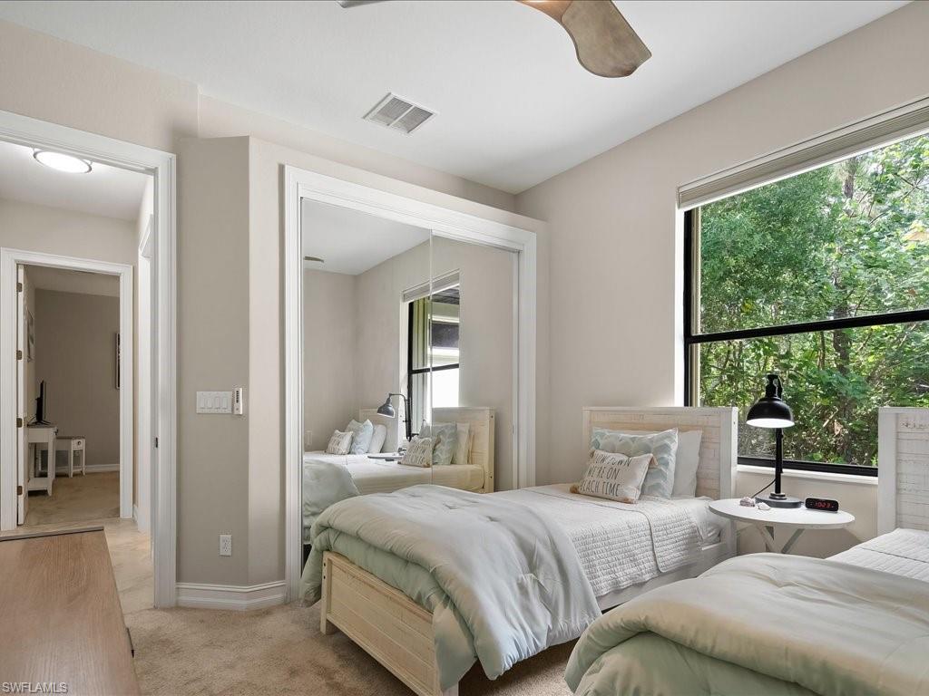 2360 19th Street Southwest Naples, FL 34117 - Photo 37 of 50 Bedroom featuring light colored carpet, baseboards, and a ceiling fan