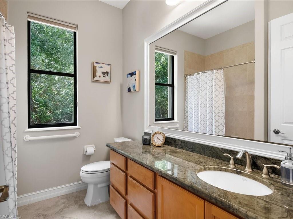 2360 19th Street Southwest Naples, FL 34117 - Photo 38 of 50 Bathroom featuring plenty of natural light, vanity, toilet, and a shower with shower curtain