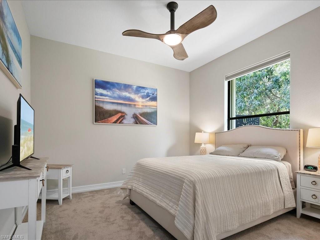 2360 19th Street Southwest Naples, FL 34117 - Photo 39 of 50 Bedroom with light carpet, baseboards, and a ceiling fan