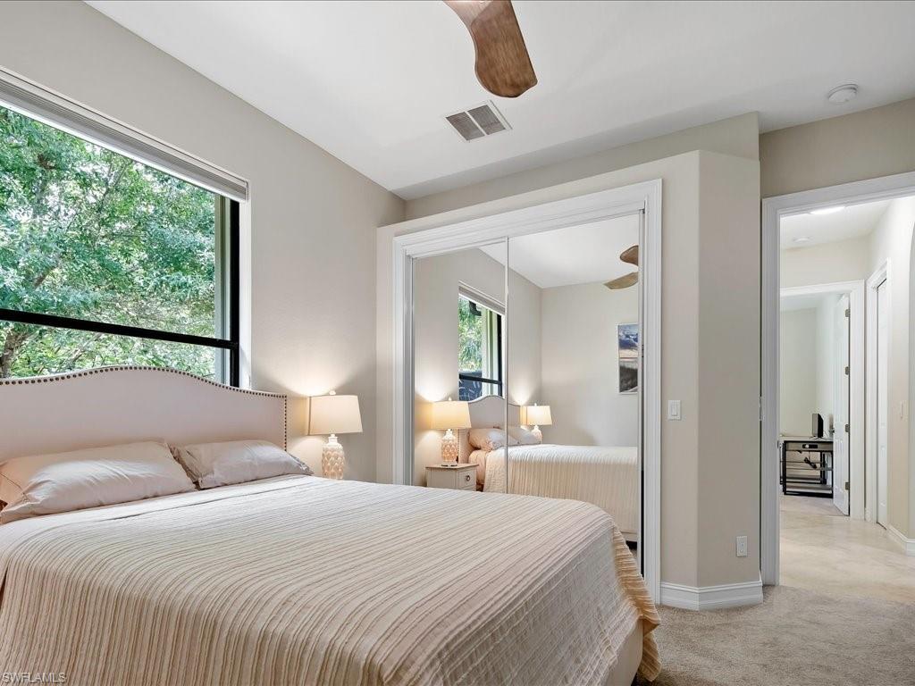 2360 19th Street Southwest Naples, FL 34117 - Photo 40 of 50 Bedroom featuring light colored carpet, baseboards, a ceiling fan, and a closet