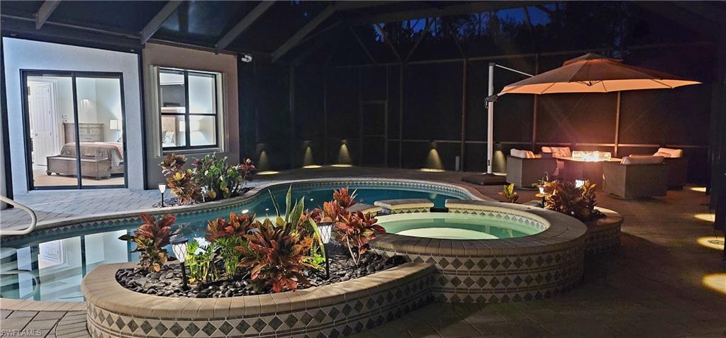 2360 19th Street Southwest Naples, FL 34117 - Photo 48 of 50 View of pool with a pool with connected hot tub and a patio area