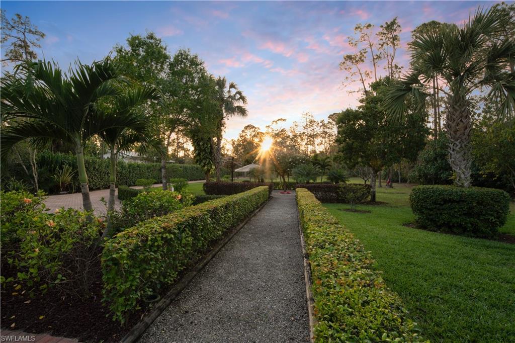 2360 19th Street Southwest Naples, FL 34117 - Photo 49 of 50 View of property's community featuring a lawn