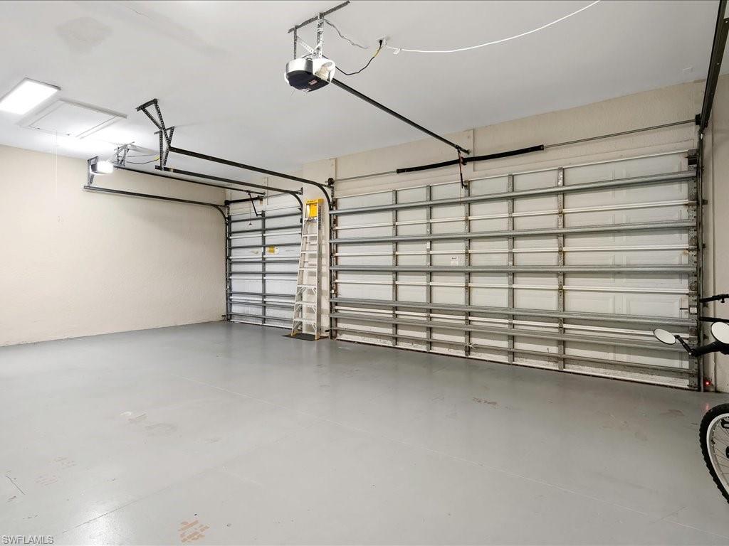 2360 19th Street Southwest Naples, FL 34117 - Photo 50 of 50 Garage featuring a garage door opener