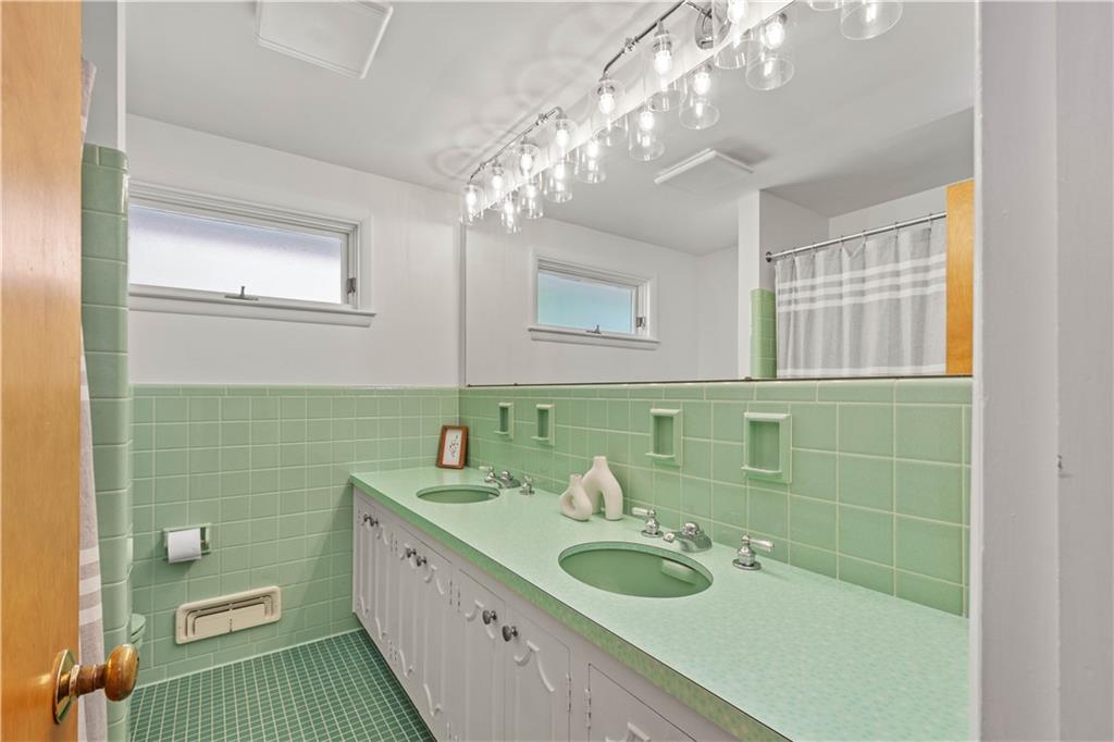 440 Miranda Road Pittsburgh, PA 15241 - Photo 24 of 45 a bathroom with a double vanity sink and a mirror