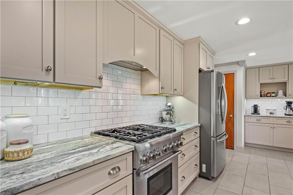 440 Miranda Road Pittsburgh, PA 15241 - Photo 6 of 45 a kitchen with stainless steel appliances granite countertop a stove a sink and a refrigerator