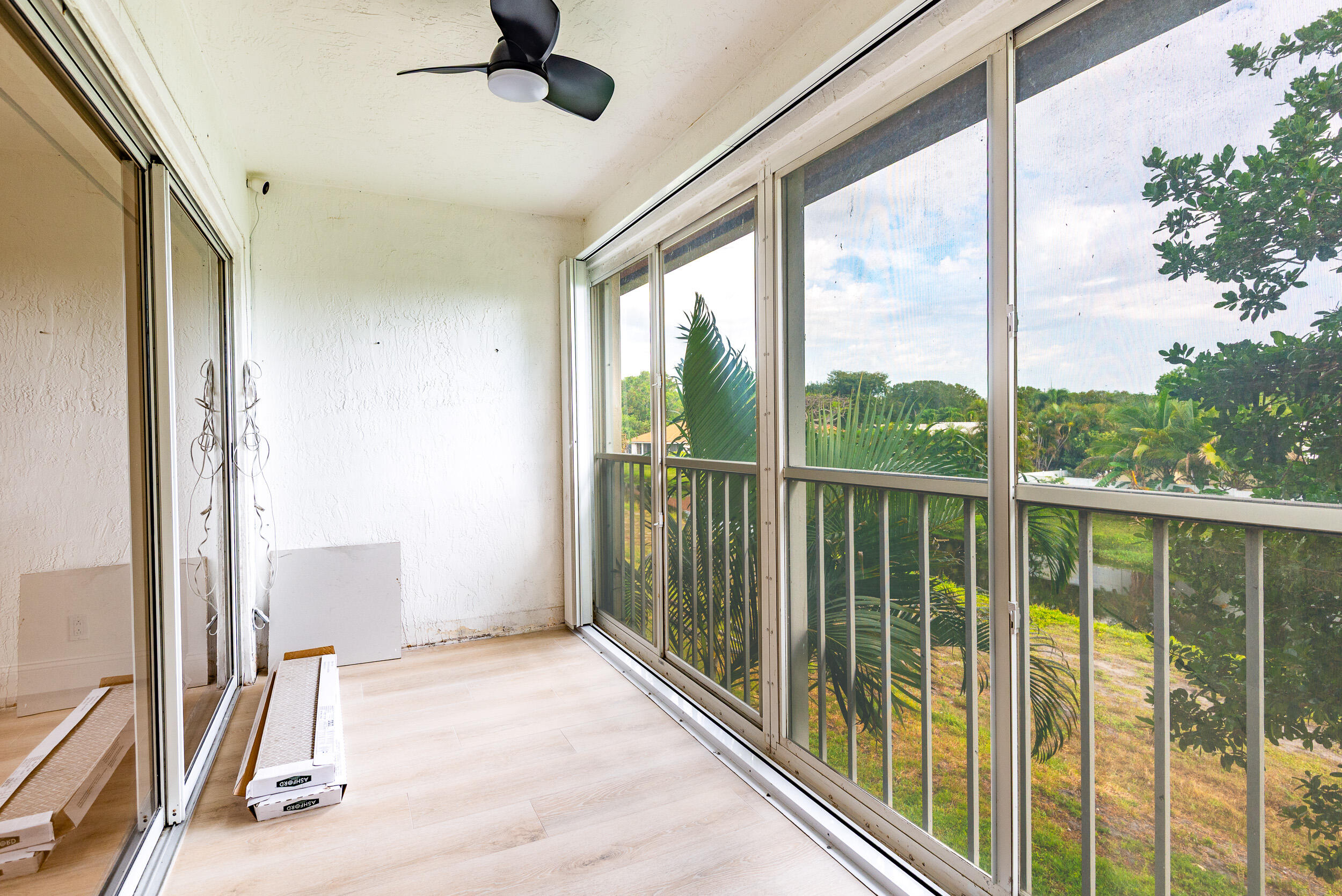 380 Northwest 67th Street, Unit J204 Boca Raton, FL 33487 - Photo 27 of 43 a view of a room with a large window