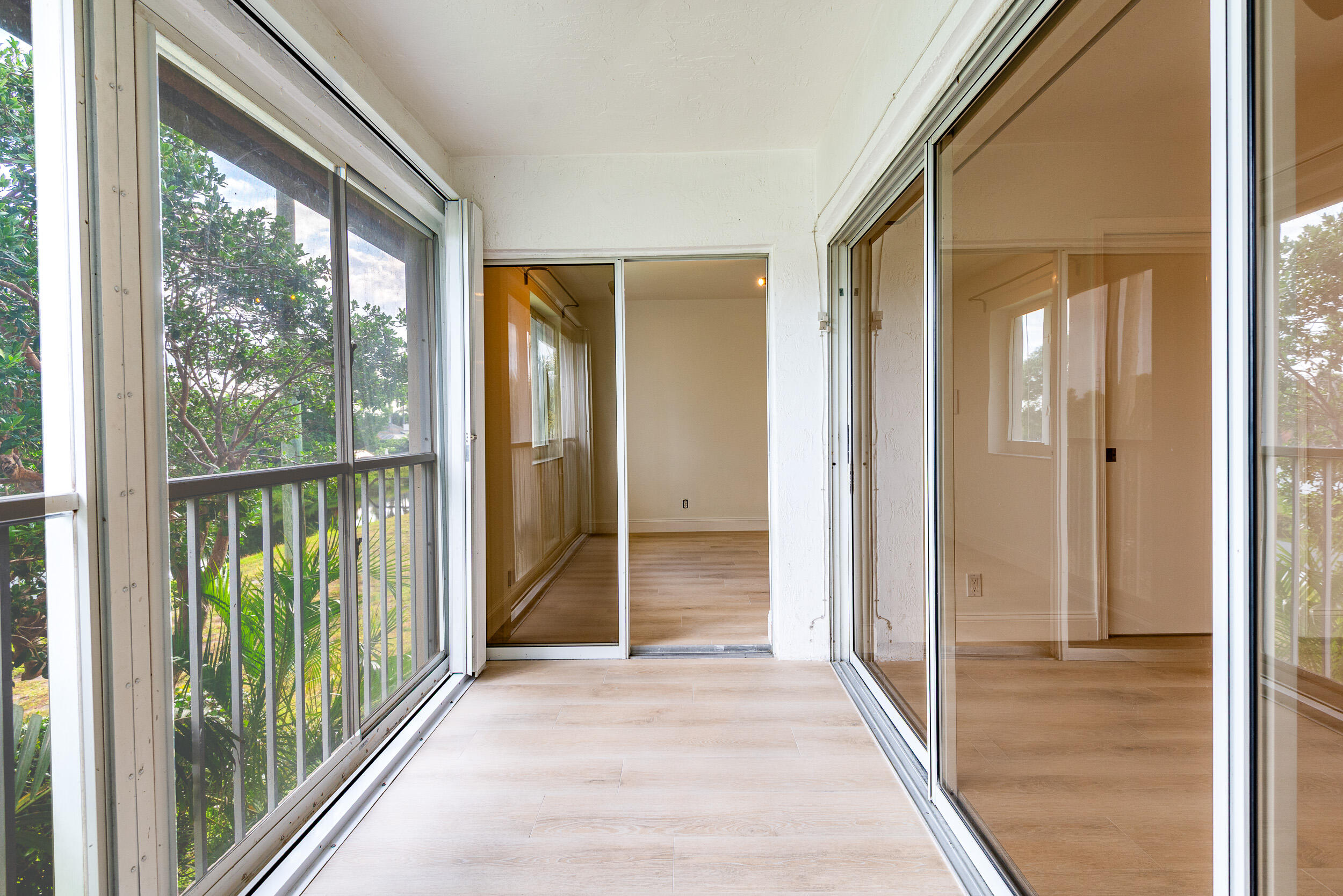 380 Northwest 67th Street, Unit J204 Boca Raton, FL 33487 - Photo 28 of 43 a view of a glass door