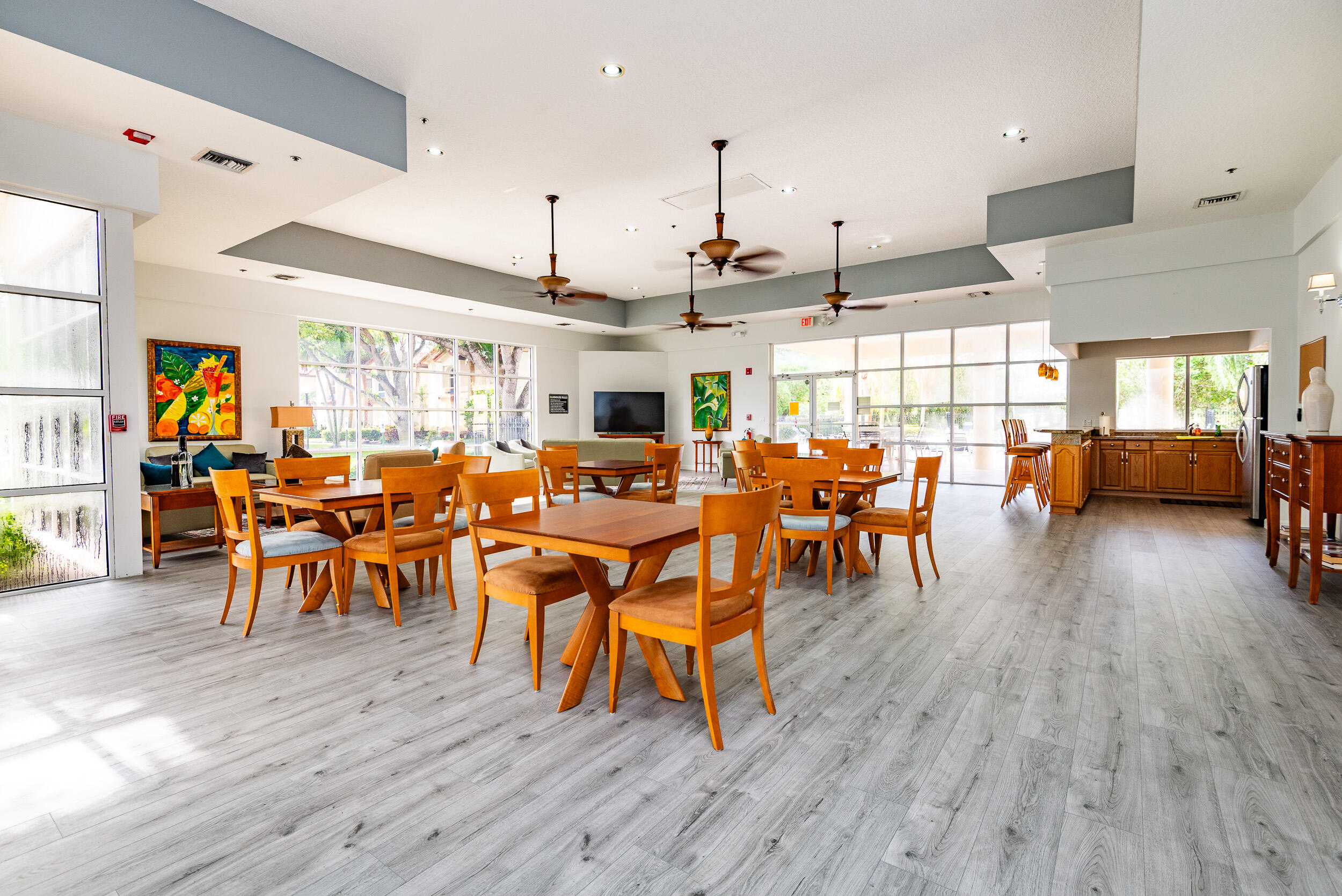 380 Northwest 67th Street, Unit J204 Boca Raton, FL 33487 - Photo 36 of 43 a very nice looking living room with dining room and wooden floor