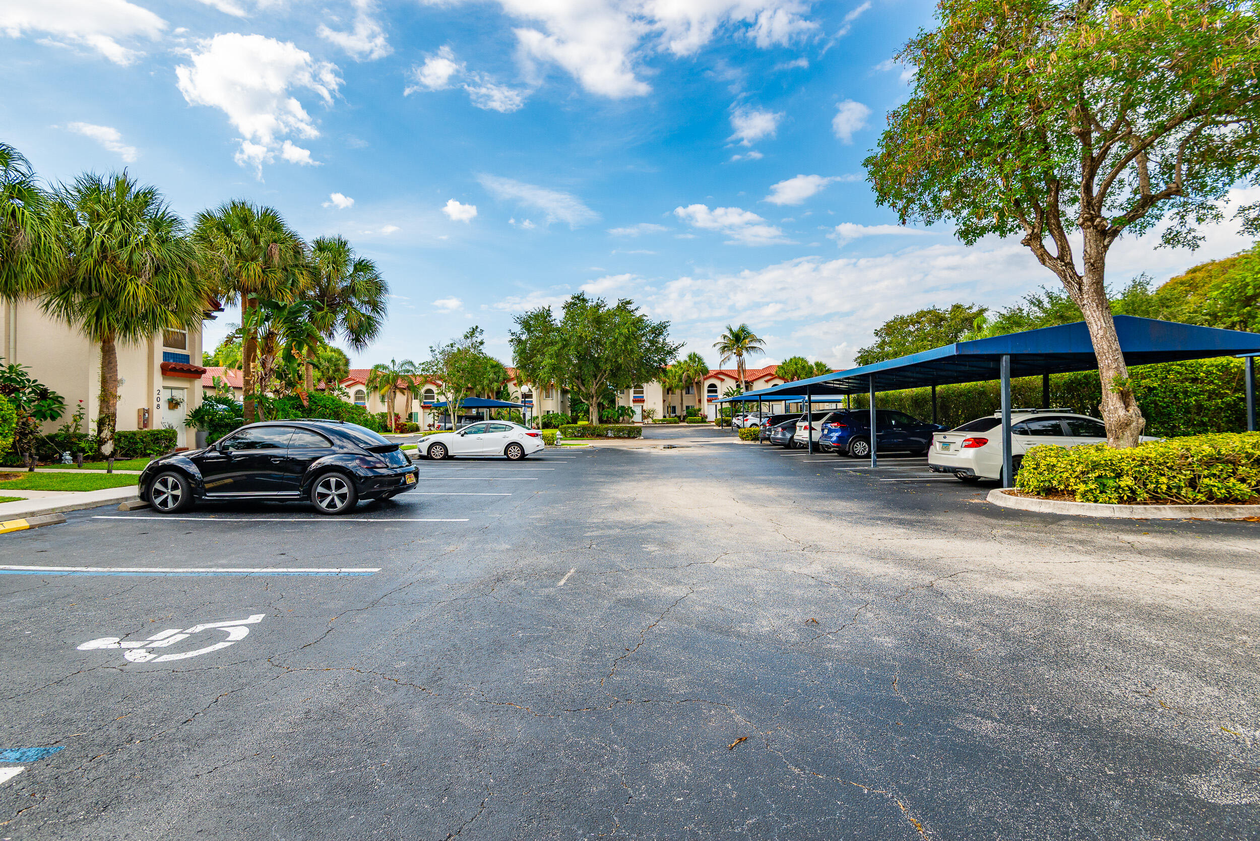 380 Northwest 67th Street, Unit J204 Boca Raton, FL 33487 - Photo 39 of 43 a view of street with parked cars