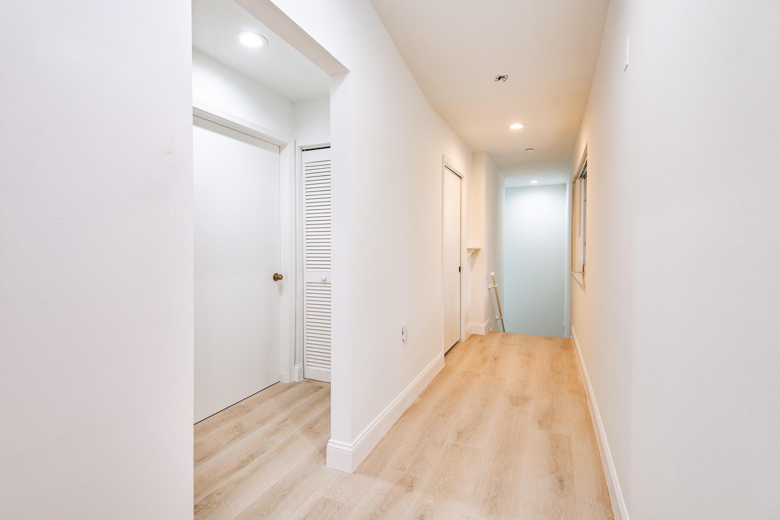 380 Northwest 67th Street, Unit J204 Boca Raton, FL 33487 - Photo 4 of 43 a view of hallway with a large mirror