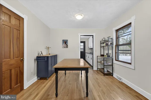 a living room with furniture or couch and a wooden floor