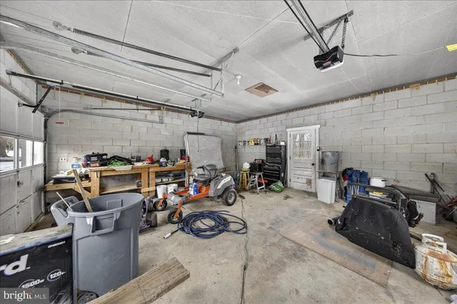 a view of a house with a yard covered with snow