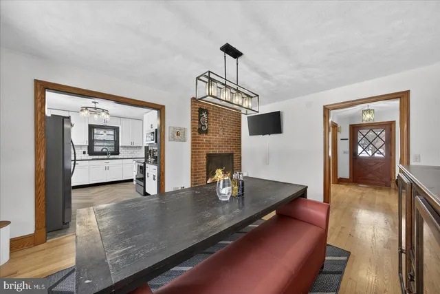 a kitchen with stainless steel appliances granite countertop a refrigerator a stove and a sink