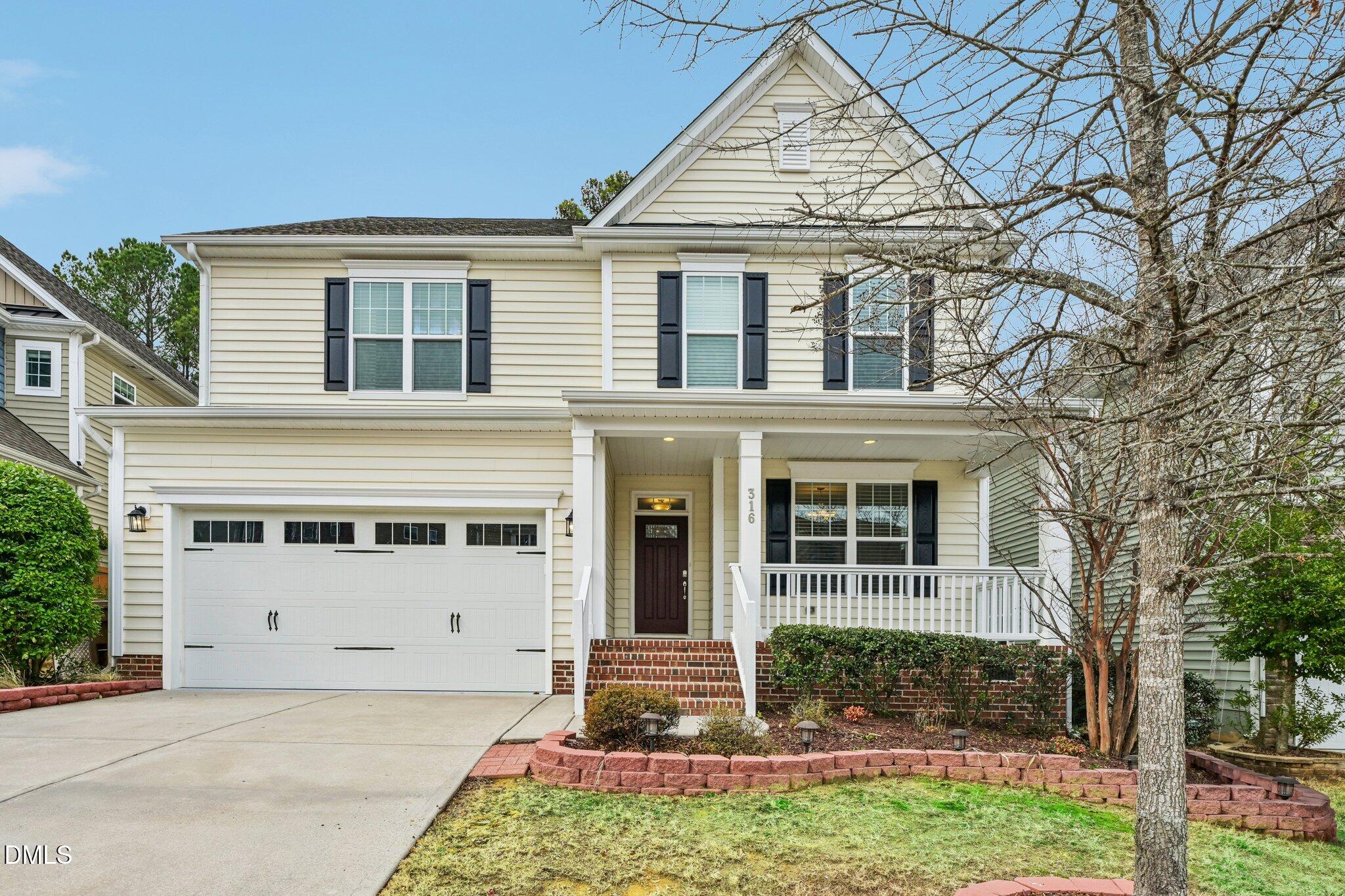 front view of a house with a yard