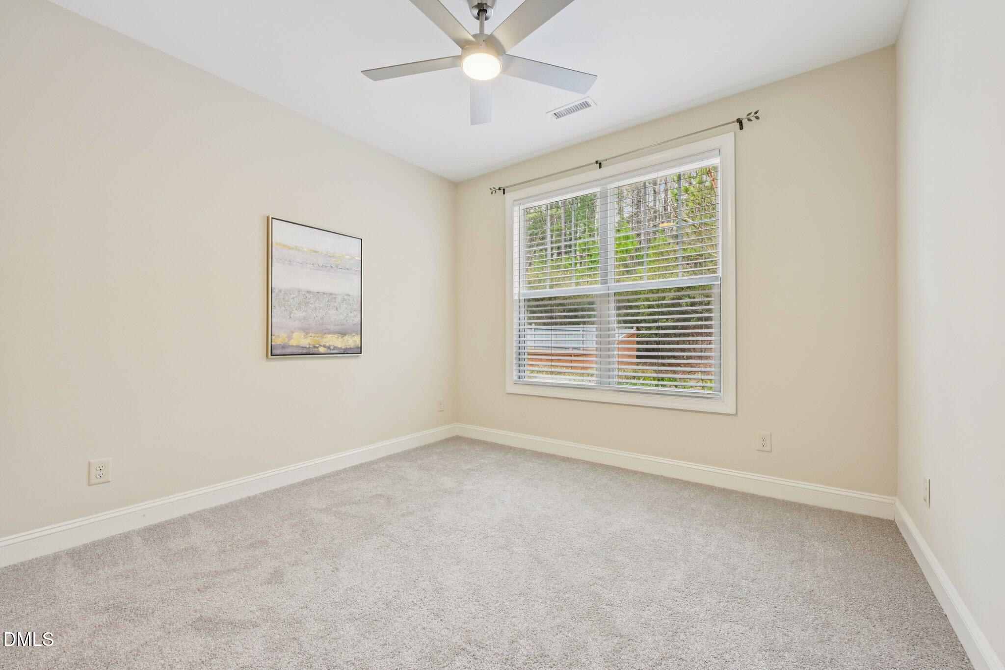 316 Rapport Drive Cary, NC 27519 - Photo 20 of 60 a view of an empty room with a window