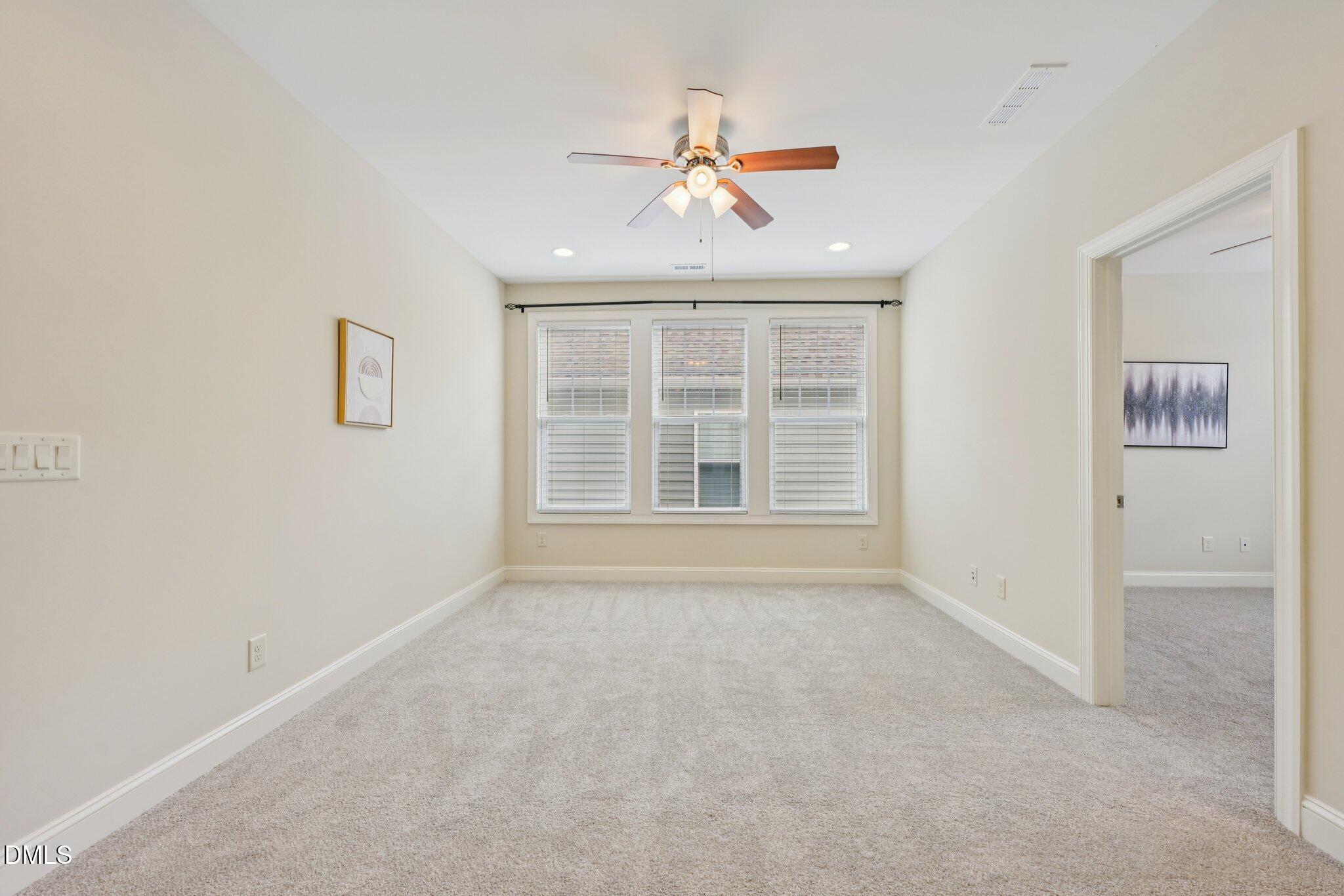 316 Rapport Drive Cary, NC 27519 - Photo 24 of 60 an empty room with windows