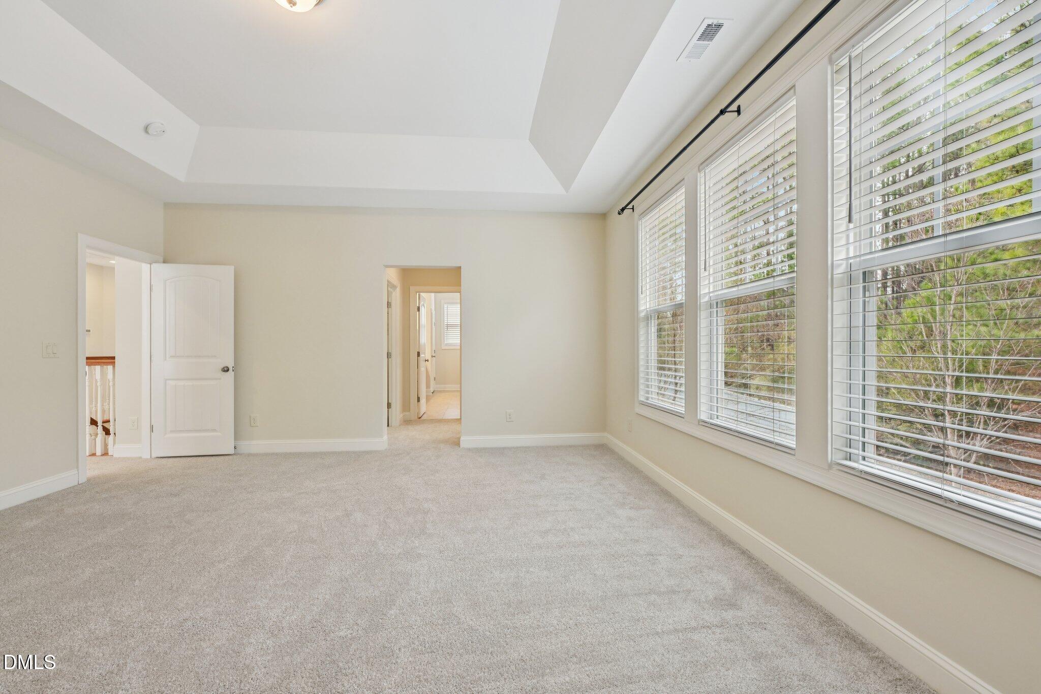316 Rapport Drive Cary, NC 27519 - Photo 28 of 60 a view of an empty room with a window
