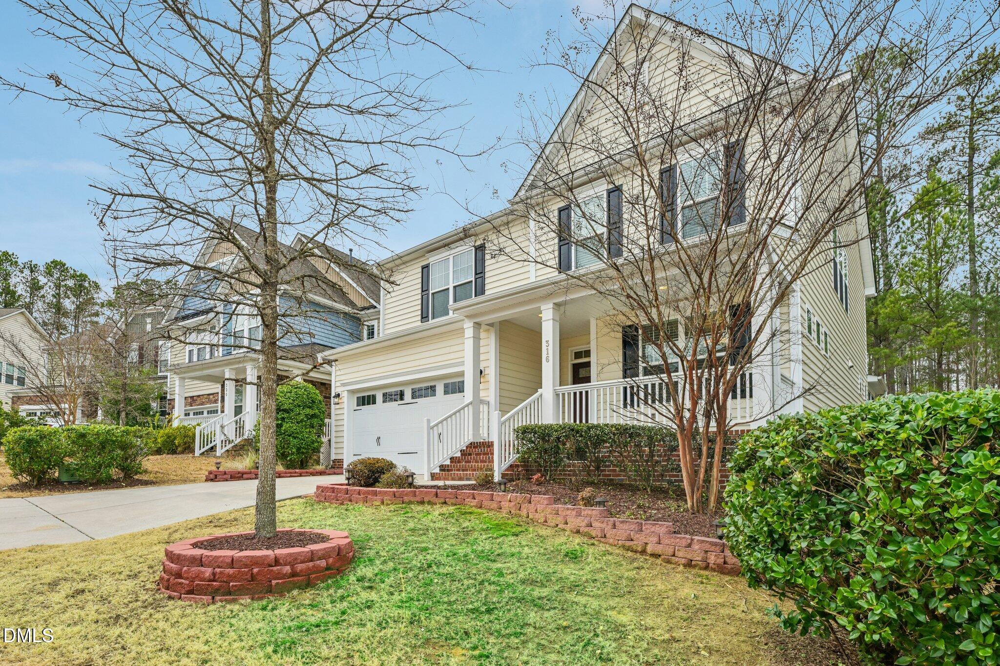 316 Rapport Drive Cary, NC 27519 - Photo 2 of 60 a front view of a house with a yard