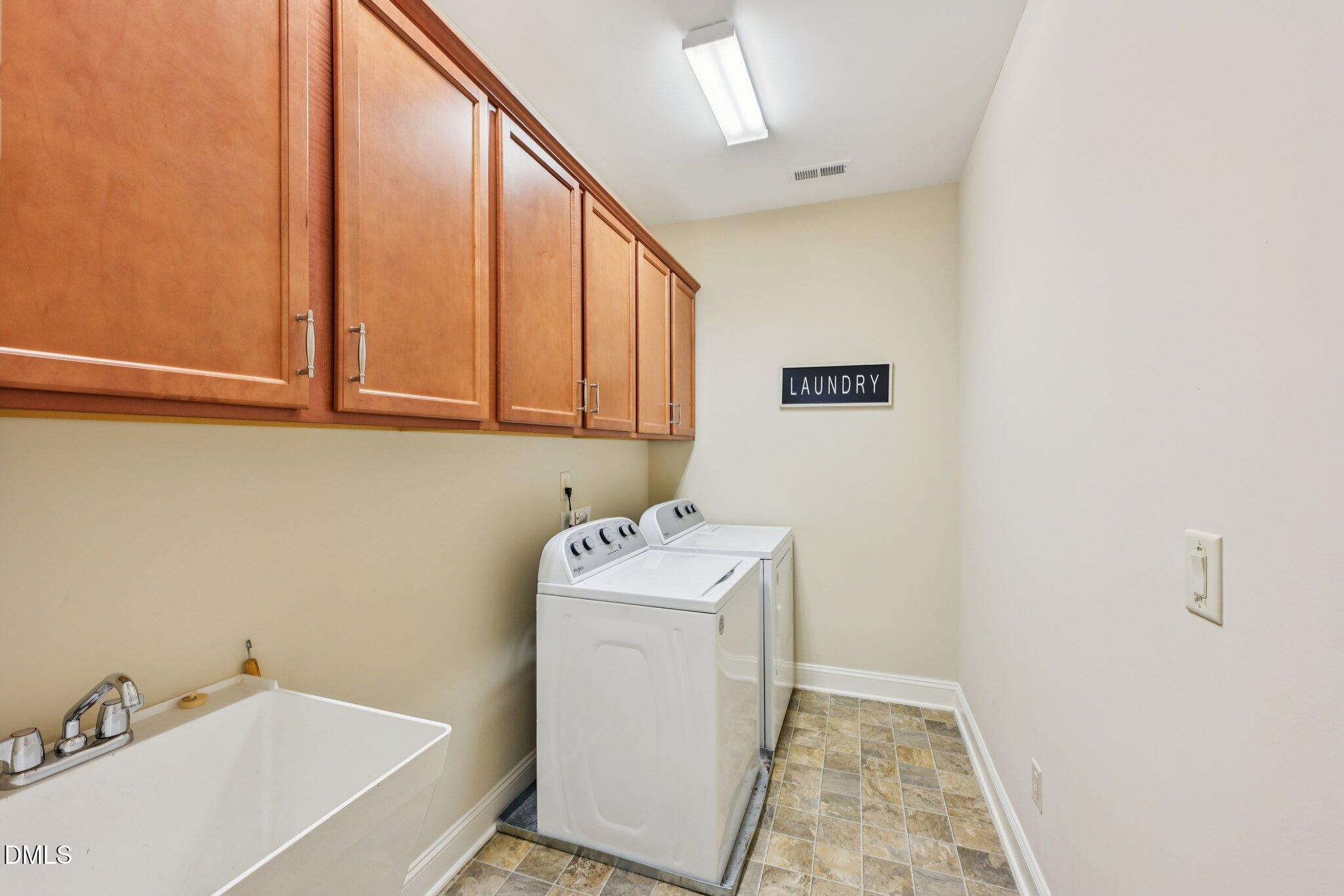 316 Rapport Drive Cary, NC 27519 - Photo 40 of 60 a bathroom with a sink and mirror with bathtub