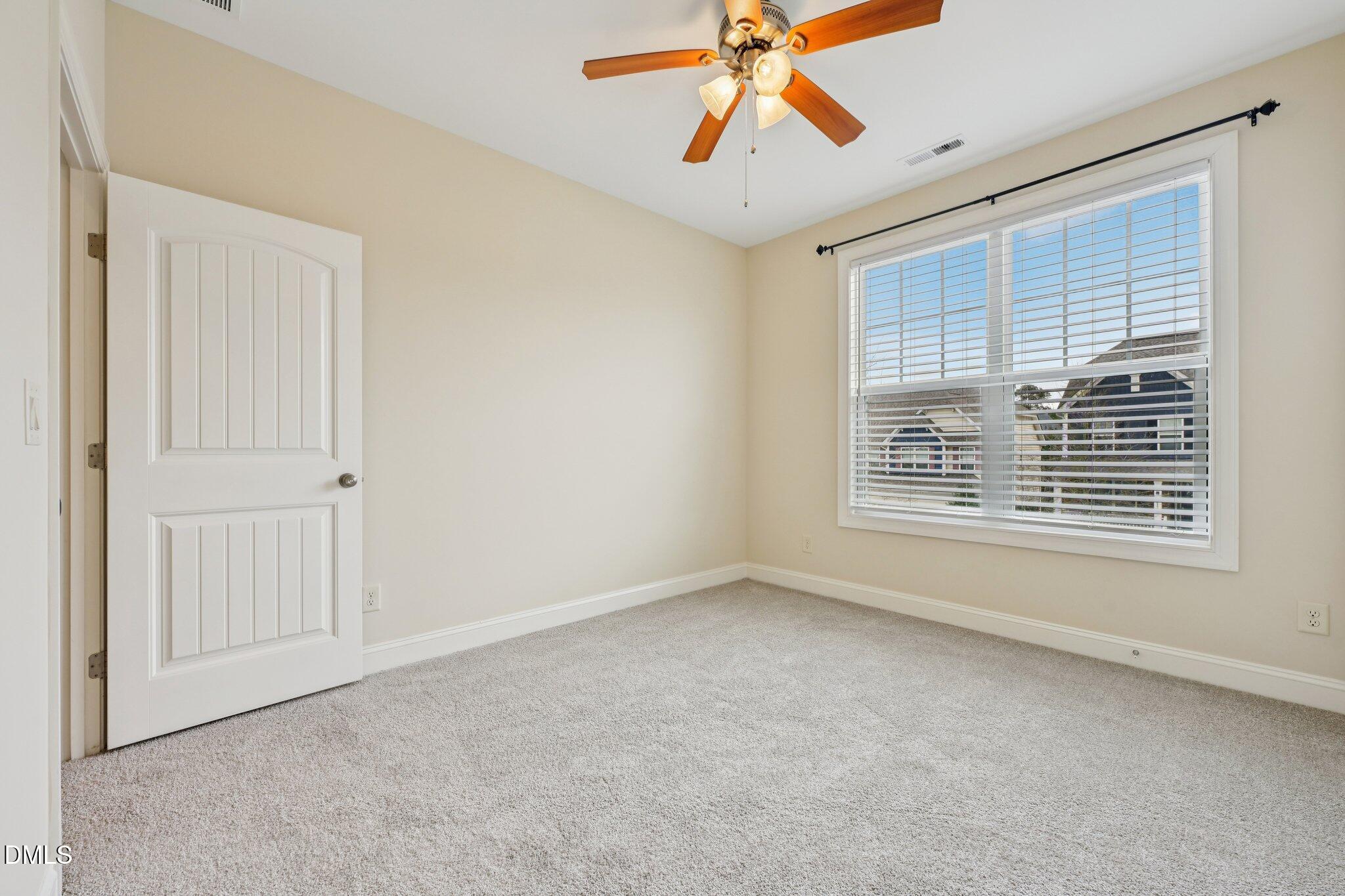 316 Rapport Drive Cary, NC 27519 - Photo 43 of 60 a view of an empty room with a window