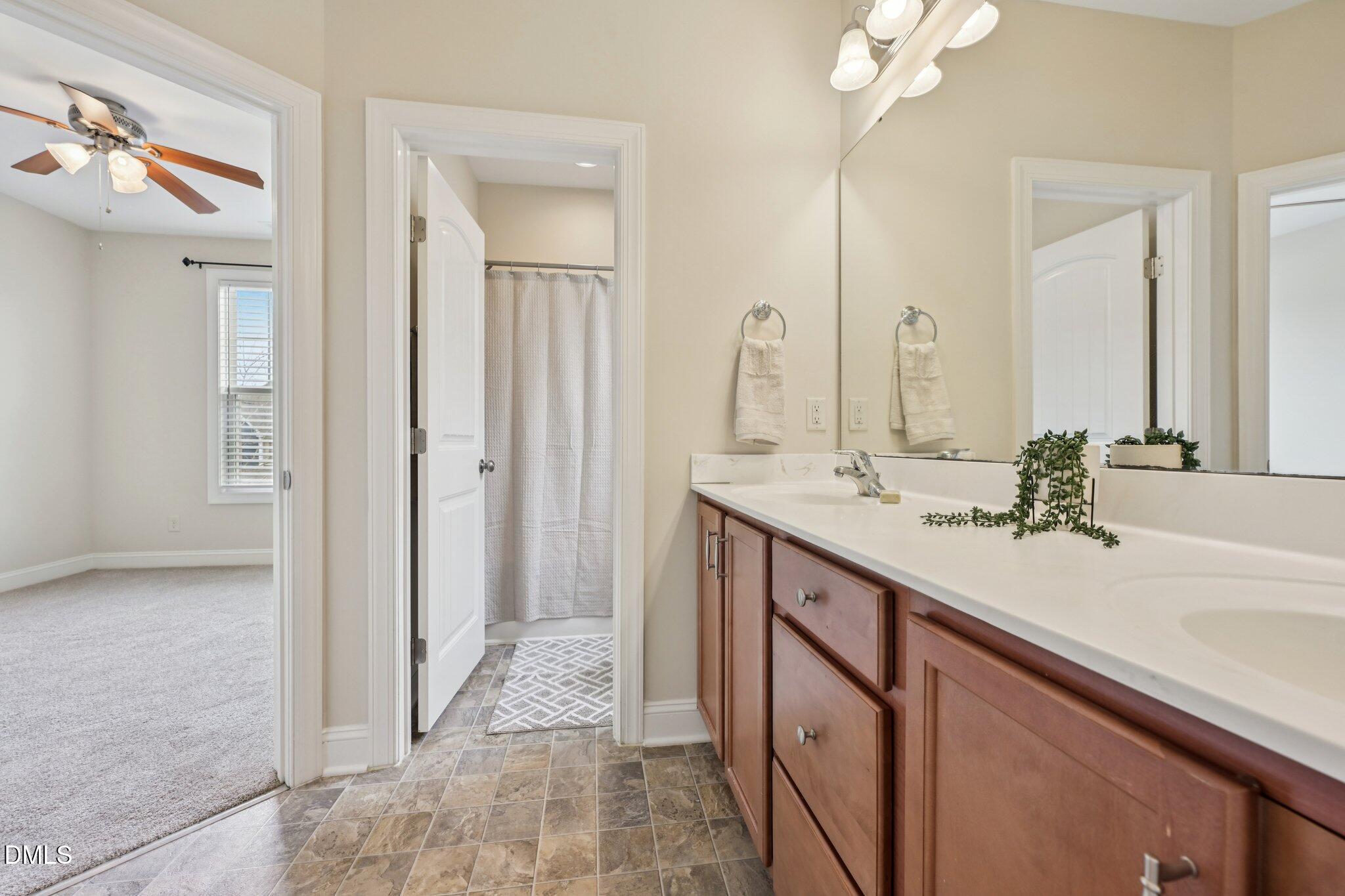 316 Rapport Drive Cary, NC 27519 - Photo 45 of 60 a bathroom with a sink and a mirror