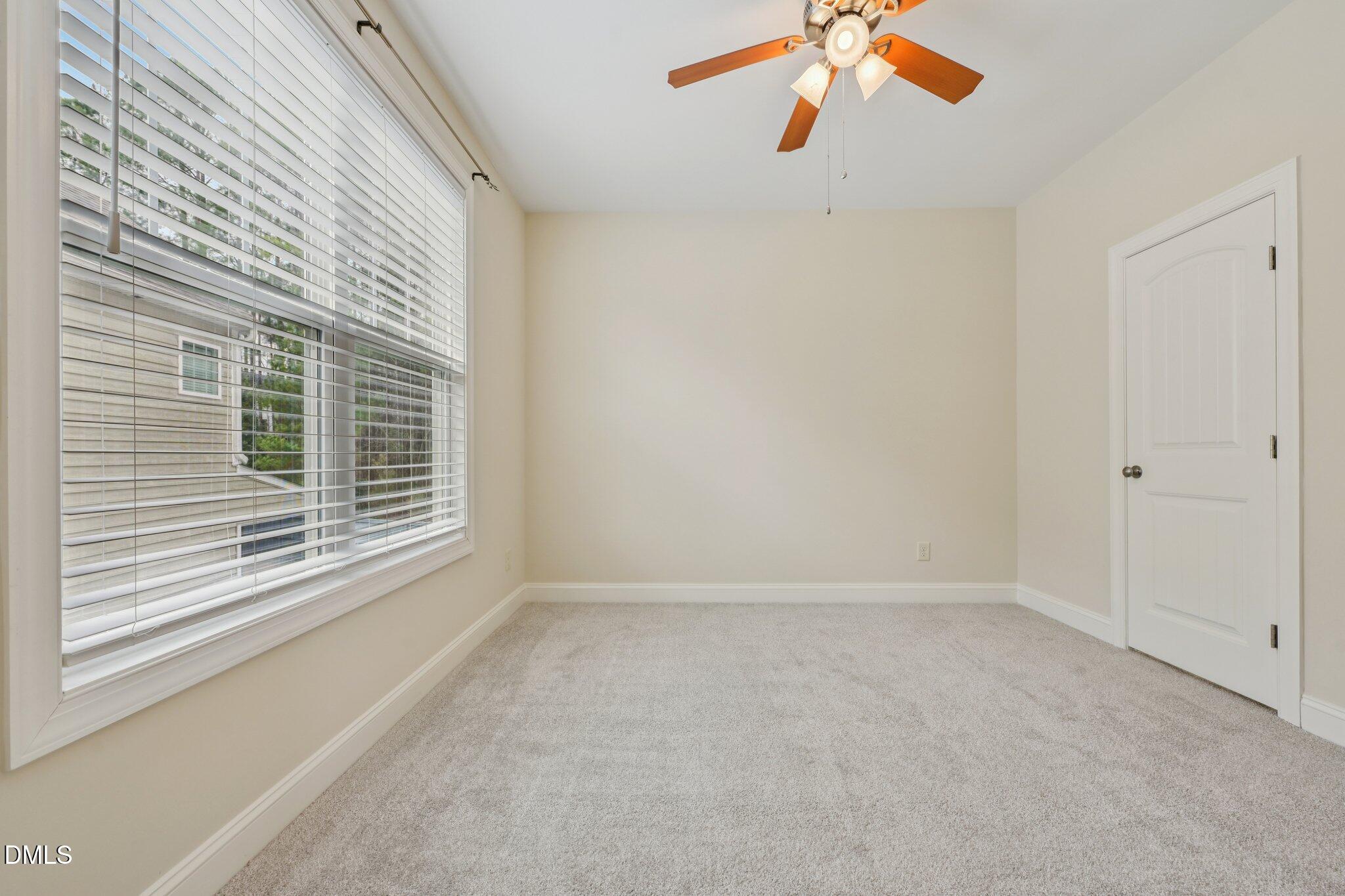 316 Rapport Drive Cary, NC 27519 - Photo 46 of 60 a view of an empty room with a window