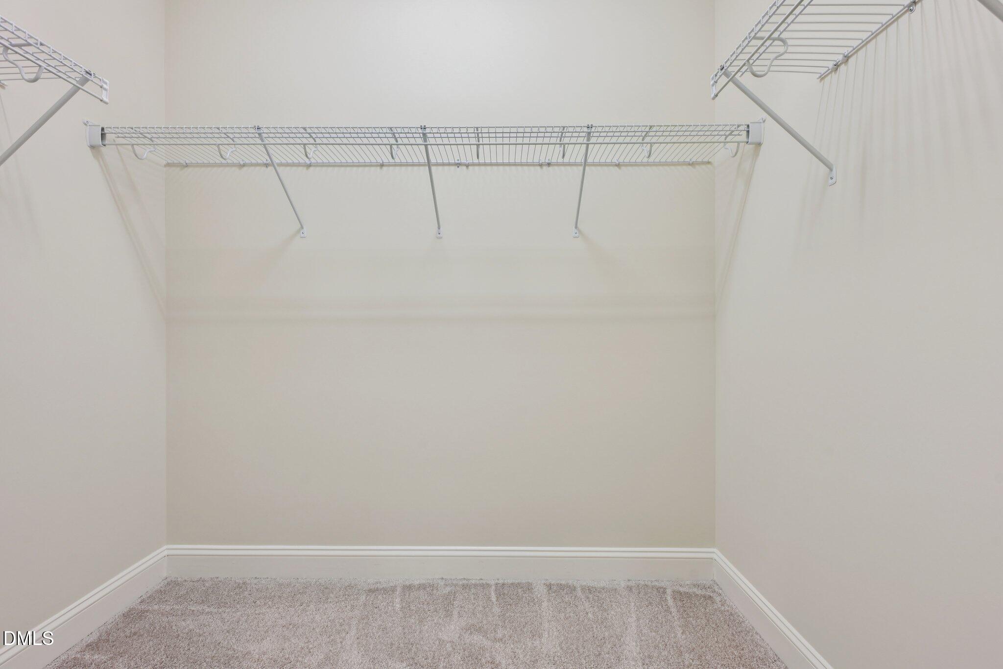 316 Rapport Drive Cary, NC 27519 - Photo 49 of 60 a view of a room with racks on the wall