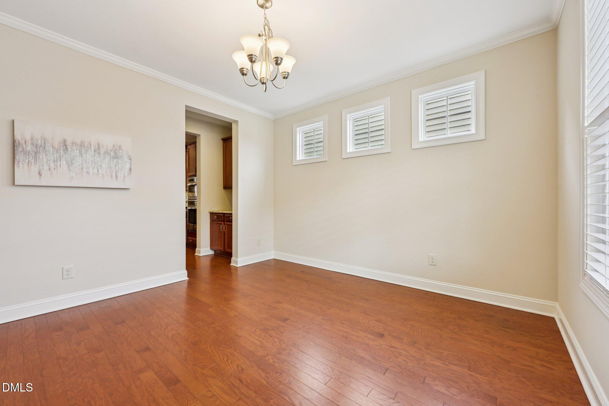 316 Rapport Drive Cary, NC 27519 - Photo 4 of 60 a view of an empty room with a window