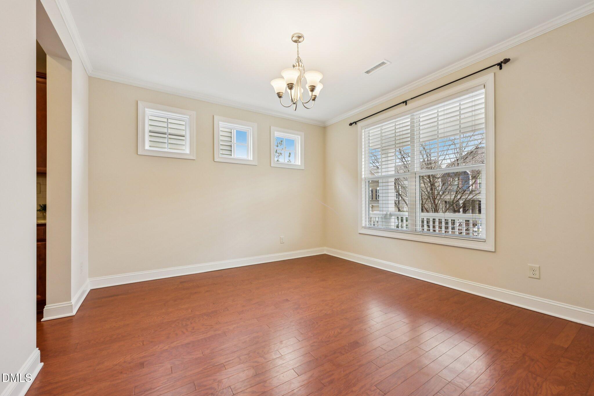 316 Rapport Drive Cary, NC 27519 - Photo 5 of 60 a view of an empty room with a window