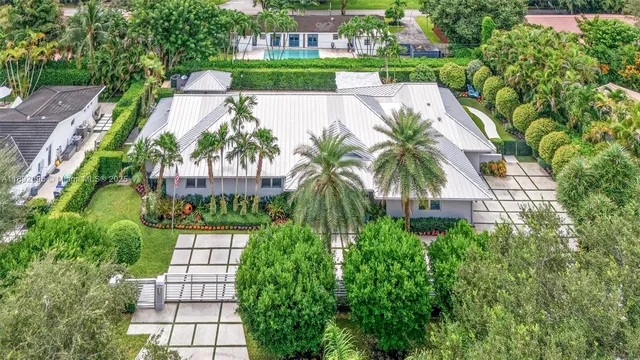 a view of a house with a yard and garage