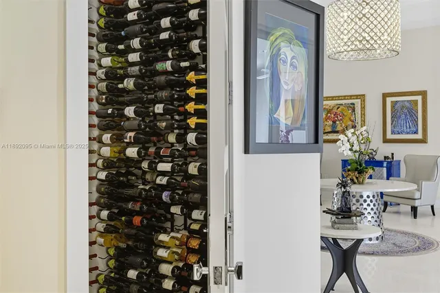 a living room with furniture and kitchen view