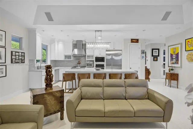 a kitchen with granite countertop a refrigerator and a stove