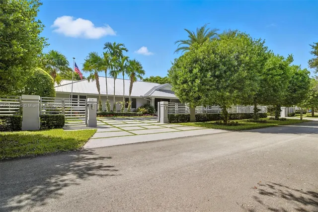 an aerial view of a house with a garden and plants