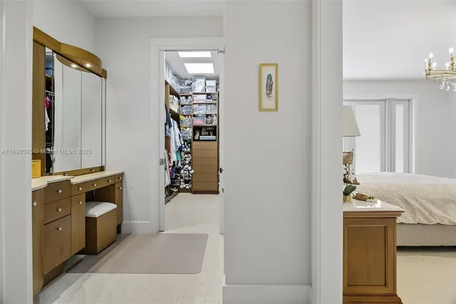 a bathroom with a sink toilet vanity and shower