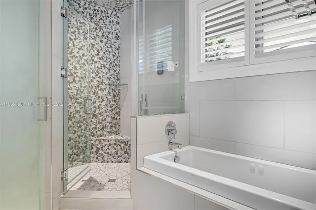 a living room with fireplace furniture and a flat screen tv