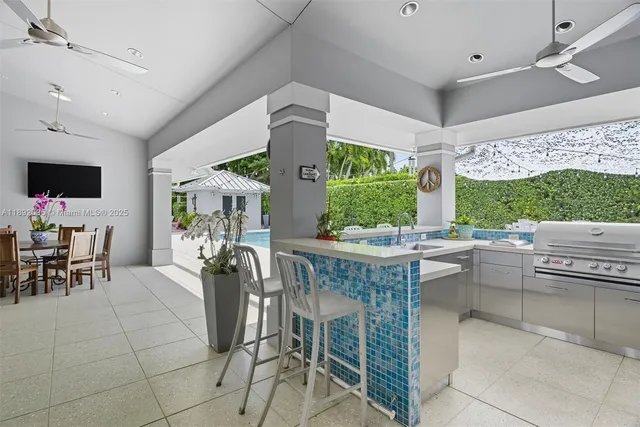 a view of a patio with table and chairs and potted plants