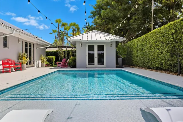 a view of a backyard with potted plants