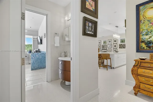 a living room with furniture kitchen and a table