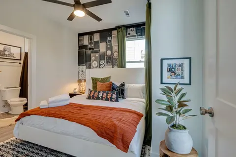 a bedroom with a bed and window