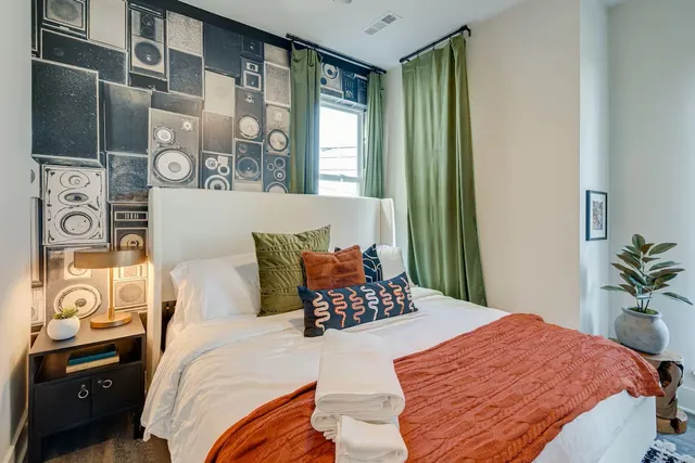 a bedroom with a bed and a window