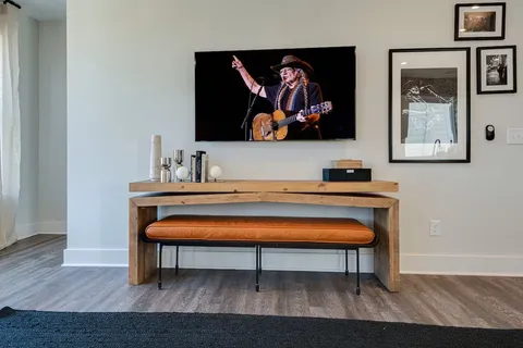 a room with chair and wall paintings