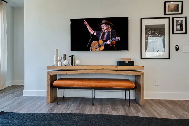 a room with chair and wall paintings