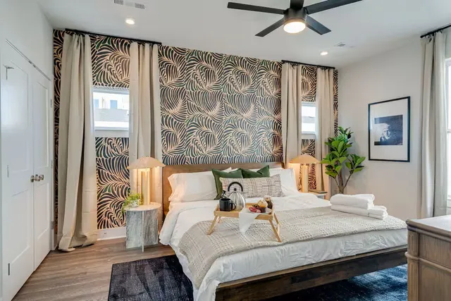 a bedroom with a bed and a window