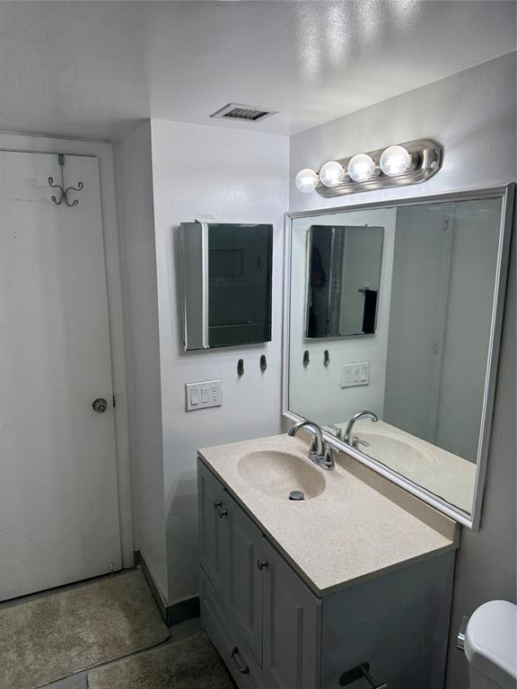 4174 Inverrary Drive, Unit 401 Lauderhill, FL 33319 - Photo 14 of 15 a bathroom with a sink double vanity and a mirror