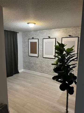 a room with furniture and a potted plant