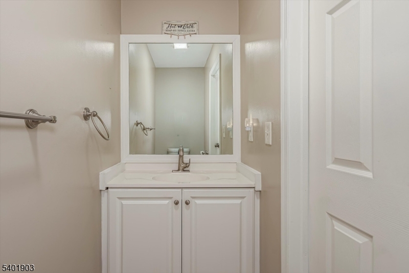223 Cherokee Road Lafayette, NJ 07848 - Photo 11 of 36 a bathroom with a sink and a mirror