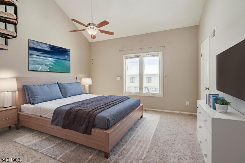 223 Cherokee Road Lafayette, NJ 07848 - Photo 13 of 36 a bedroom with a bed and a flat screen tv