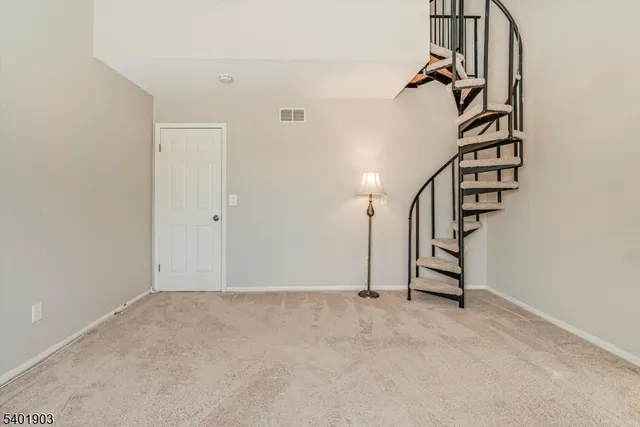 a view of a room with staircase