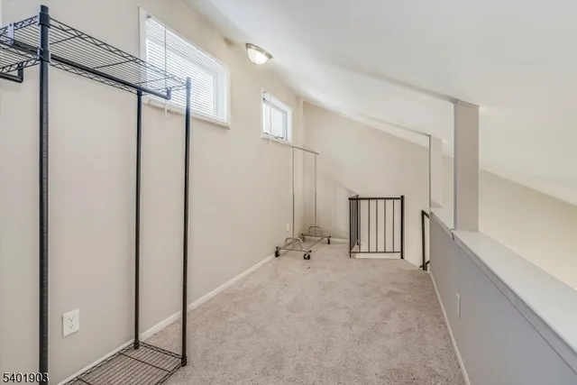 an entryway in a hall with a window